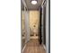 Hallway with a closet and an adjacent bathroom at 5674 Kingsport Dr # 4, Atlanta, GA 30342