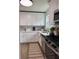 Beautiful kitchen featuring white cabinets, stainless steel appliances, and wood-look floors at 5674 Kingsport Dr # 4, Atlanta, GA 30342