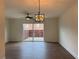 Spacious living room featuring wood floors and sliding glass doors to a private patio at 5674 Kingsport Dr # 4, Atlanta, GA 30342