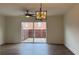 Open living room featuring wood floors and sliding glass doors to the backyard at 5674 Kingsport Dr # 4, Atlanta, GA 30342