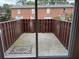 Private fenced patio with a view of the building and outdoor rug at 5674 Kingsport Dr # 4, Atlanta, GA 30342