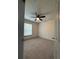 Well-lit bedroom showcasing a ceiling fan, plush carpeting, and a large window at 3204 Fairington Village Dr, Lithonia, GA 30038