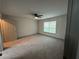 Spacious bedroom featuring neutral walls, large window, and ceiling fan for comfort at 3204 Fairington Village Dr, Lithonia, GA 30038