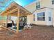 Backyard patio and outdoor seating area with an attached awning at 5175 Bridle Point Pkwy, Snellville, GA 30039