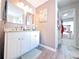 Bathroom with double vanity, framed mirrors, and granite countertops, offering ample space at 5175 Bridle Point Pkwy, Snellville, GA 30039