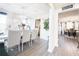 Open dining room with elegant decor, bright lighting, and connection to the adjacent kitchen at 5175 Bridle Point Pkwy, Snellville, GA 30039