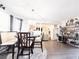 Open concept dining room with elegant lighting, wood table, and hardwood flooring at 5175 Bridle Point Pkwy, Snellville, GA 30039