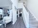 Spacious foyer with hardwood floors, staircase, and ample natural light at 5175 Bridle Point Pkwy, Snellville, GA 30039