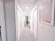 Hallway with neutral walls, carpet, and white doors to other rooms at 5175 Bridle Point Pkwy, Snellville, GA 30039