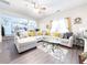 Open-concept living area showcases ample natural light, wood floors, and stylish furnishings at 5175 Bridle Point Pkwy, Snellville, GA 30039