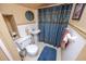 Cozy bathroom with pedestal sink, toilet, and decorative shower curtain at 970 E Main St, Canton, GA 30114