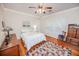 Bright bedroom with hardwood floors, a ceiling fan, and ample natural light at 970 E Main St, Canton, GA 30114