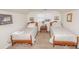 Cozy bedroom featuring twin beds, neutral decor, and natural light at 970 E Main St, Canton, GA 30114