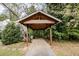 Wooden carport offering covered parking or a protected outdoor space at 970 E Main St, Canton, GA 30114