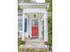 Inviting front entrance with stone steps, white columns, and a bright red door at 970 E Main St, Canton, GA 30114