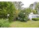 Front yard with mature trees, providing shade and enhancing the curb appeal at 970 E Main St, Canton, GA 30114