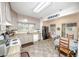 Well-lit kitchen with white cabinets, modern appliances, and a cozy dining area at 970 E Main St, Canton, GA 30114