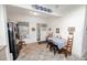 Eat-in kitchen featuring updated appliances and a breakfast table, bathed in natural light at 970 E Main St, Canton, GA 30114