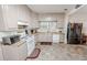 Bright kitchen featuring updated appliances, ample counter space, and neutral color scheme at 970 E Main St, Canton, GA 30114