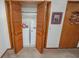 Laundry closet featuring washer, dryer, and shelving for storage at 970 E Main St, Canton, GA 30114
