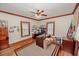 Office space with hardwood floors, two windows and boxes on the floor at 970 E Main St, Canton, GA 30114