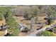 High-angle view of a house, driveway, tree-lined boundary, and greenery surrounding the property at 4065 Thaxton Rd, Atlanta, GA 30349