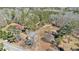 Aerial view of a property showing the house, surrounding trees, and the landscape at 4065 Thaxton Rd, Atlanta, GA 30349