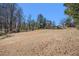 Spacious lot with the house in the distance, presenting a great opportunity at 4065 Thaxton Rd, Atlanta, GA 30349