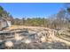 Large lot featuring terraced backyard, perfect for gardening or outdoor living at 4065 Thaxton Rd, Atlanta, GA 30349