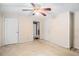 Bedroom featuring carpet, a ceiling fan and access to the next room at 4065 Thaxton Rd, Atlanta, GA 30349