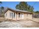 The house features a neutral exterior, multiple windows, and a well-kept landscape at 4065 Thaxton Rd, Atlanta, GA 30349