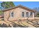 Exterior daytime view of cozy home on lot with multiple windows at 4065 Thaxton Rd, Atlanta, GA 30349