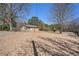 Charming single-story home with a front yard, mature trees, and a welcoming facade at 4065 Thaxton Rd, Atlanta, GA 30349