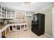 Bright kitchen featuring essential appliances and tiled flooring at 4065 Thaxton Rd, Atlanta, GA 30349