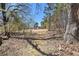 Scenic view of a beautiful lot, perfect for building your dream home surrounded by nature and mature trees at 4065 Thaxton Rd, Atlanta, GA 30349
