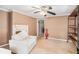 Bright living room with a white chair, red vase and view to another room at 4065 Thaxton Rd, Atlanta, GA 30349