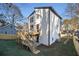 Backyard view featuring a wooden deck with stairs and a newly installed wooden fence at 608 S Evelyn Nw Pl, Atlanta, GA 30318