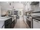 Bright kitchen with large island, stainless steel appliances, and modern finishes at 608 S Evelyn Nw Pl, Atlanta, GA 30318