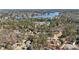 Aerial view of a beautiful neighborhood with mature trees and lake at 741 Bentwood Trce, Alpharetta, GA 30005
