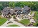 Aerial view of a clubhouse with extensive landscaping and outdoor seating at 741 Bentwood Trce, Alpharetta, GA 30005
