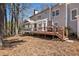 The home features a backyard deck with stairs to a manicured lawn at 741 Bentwood Trce, Alpharetta, GA 30005