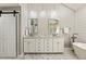 Stylish bathroom with double vanity, modern fixtures, and a barn door at 741 Bentwood Trce, Alpharetta, GA 30005