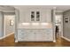 Elegant built-in cabinetry provides storage and display space between transition ways in a dining area at 741 Bentwood Trce, Alpharetta, GA 30005