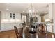 Open dining room with wood floors, recessed lighting, and views of the kitchen at 741 Bentwood Trce, Alpharetta, GA 30005