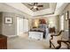Elegant main bedroom features a trey ceiling, barn door, and cozy chair seating at 741 Bentwood Trce, Alpharetta, GA 30005