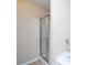 Enclosed shower with sliding glass door at 1378 Penhurst Dr, Lawrenceville, GA 30043