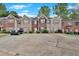 Exterior view of townhomes showing parking in front at 1573 Eastern Sunrise Ln, Decatur, GA 30034