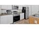 Bright kitchen features stainless steel appliances and granite countertops at 1573 Eastern Sunrise Ln, Decatur, GA 30034