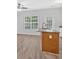 Kitchen island with wood facade and view of white cabinets and stainless appliances at 1573 Eastern Sunrise Ln, Decatur, GA 30034