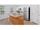 Bright kitchen with a center island and stainless steel appliances at 1573 Eastern Sunrise Ln, Decatur, GA 30034